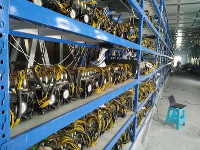 High-tech mining farm with rows of machines in climate-controlled environment